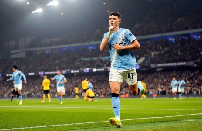 Manchester City’s Phil Foden celebrates scoring the opening goal during the Champions League opening phase match against Borussia Dortmund on Wednesday, November 5, 2025 in Manchester, England.