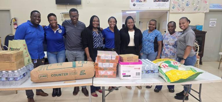 Members of Mount Pleasant Football Academy and Jacob’s Ladder pose for a photograph following the club’s donation of supplies recently.