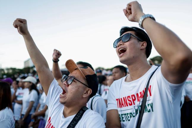 Members of the religious sect Iglesia Ni Cristo (Church of Christ) shout slogans during a three-day anti-corruption rally at Manila’s Rizal Park, Philippines.