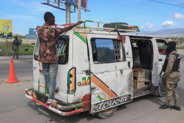Police officers patrol an area near the Toussaint Louverture International Airport in Port-au-Prince, Haiti.