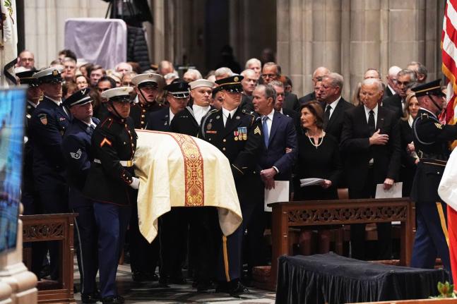 Former Presidents front row from left, George W Bush with Laura Bush and Joe Biden with Jill Biden, look on as military pall bearers arrive with the casket of former Vice President Dick Cheney at the Washington National Cathedral, Thursday, November 20, 20