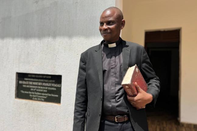 Rev. Robert Wantsala, vicar of a small Anglican parish in eastern Uganda, stands at the headquarters of the diocese in Mbale.