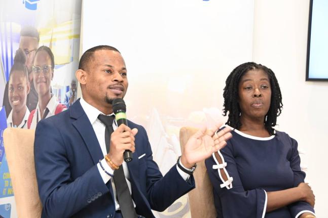 Devrhoid Davis (left) makes a point at the Smarter Credit Course workshop. Looking on is Dawnett Pryce-Thompson.