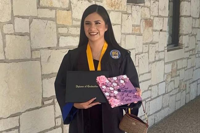 In this undated photo provided by her attorney, Todd Pomerleau, Any Lucia Lopez Belloza celebrates her high school graduation in Texas.