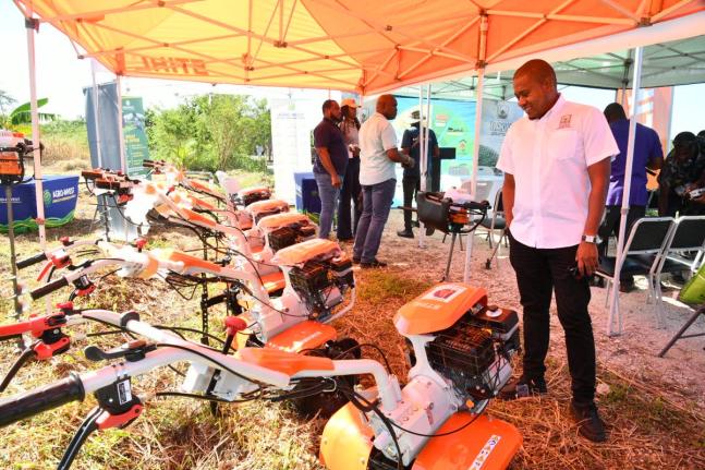 Minister of Agriculture, Fisheries and Mining, Floyd Green, surveys the walk-behind tractors and earth augers that were handed over in a ceremony on Wednesday,November 26, 2025, at the Amity Hall Agro-Park in St Catherine. The equipment will be distributed