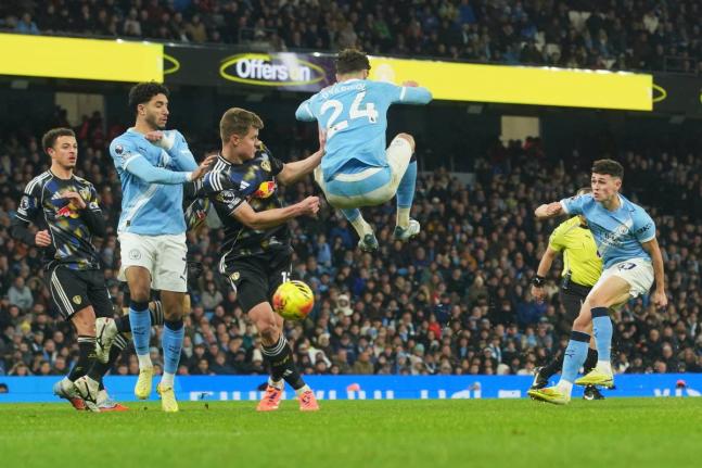 AP 
Manchester City’s Phil Foden (right) scores during the English Premier League football match against Leeds United in Manchester, England yesterday.