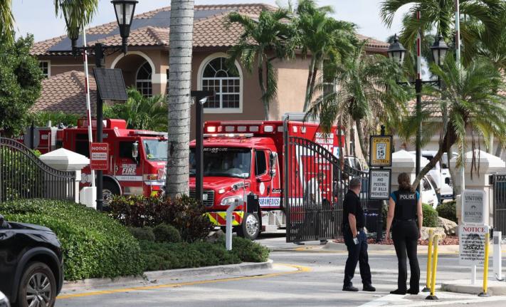 Emergency personnel from Coral Springs and Coconut Creek are on scene where a plane crashed in the Windsor Bay community in Coral Springs on Monday, November 10, 2025. (Carline Jean/South Florida Sun-Sentinel via AP)
