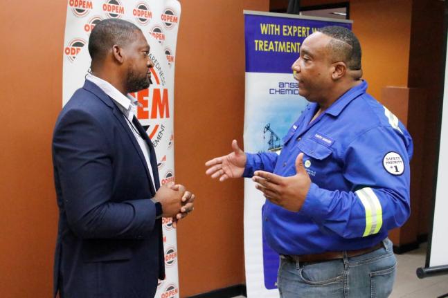 Commander Alvin Gayle, director general of the Office of Disaster Preparedness and Emergency Management (ODPEM) converses with Stephen Summers, country manager of Ansa Chemicals Jamaica, at the relief support handover at the ODPEM.