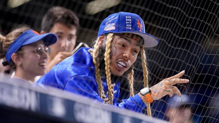  Rapper Tekashi 6ix9ine watches a baseball game between the Miami Marlins and New York Mets, August 3, 2021, in Miami. 
