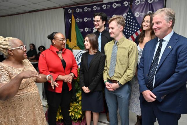 Winnie Berry (left), deputy CEO for curriculum support at the Ministry of Education, Skills, Youth and Information, speaks with Scott Renner (right), Chargé d’Affaires at the US Embassy; Tammy L. Palmer (second left), Peace Corps country director; and v