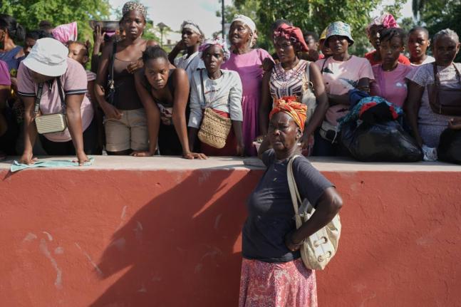 Residents attend the funeral of people killed in a landslide triggered by Hurricane Melissa in Petit-Goave, Haiti, Saturday, November 15.