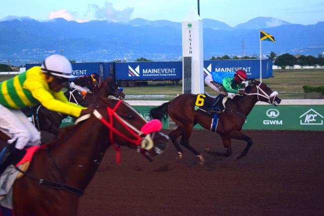 ANOTHER ONE (right) ridden by Dane Nelson wins the Charles Hussey OD Trophy race over five furlongs straight by a nose from COMMANDER Z (Ian Spence)  at Caymanas Park yesterday.