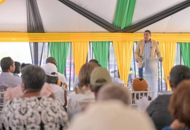 Prime Minister Dr Andrew Holness addressing a land titling ceremony at the Lacovia Community Centre in St Elizabeth on Friday, December 12, 2025.