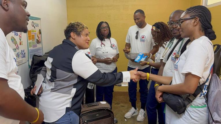 State Minister for Health and Wellness, Krystal Lee, greets members of the medical team that recently provided care to St Ann residents.