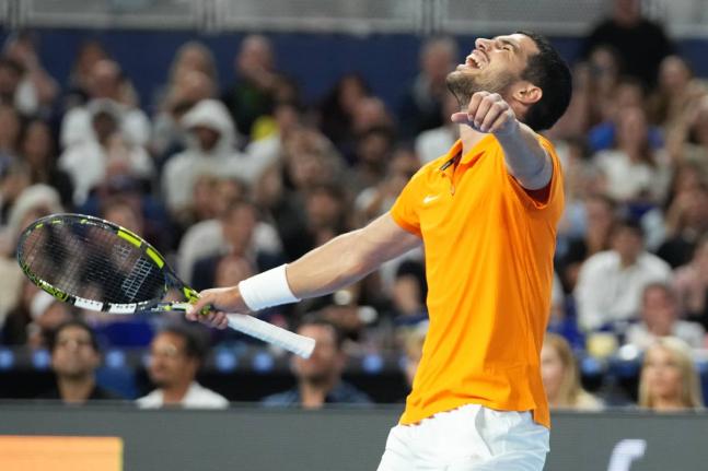 Carlos Alcaraz reacts after winning the first set against Joao Fonseca during the Miami Tennis Invitational tournament on December 8, 2025, in Miami, United States.