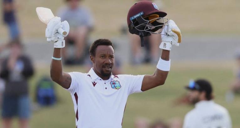 
Kavem Hodge raises his bat on the occasion of scoring a half-century against New Zealand on the third day of the third Test against New Zealand at the Bay Oval in Mount Maunganui on Friday night.