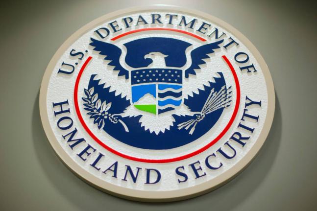 The Department of Homeland Security logo is seen during a news conference in Washington, February 25, 2015.