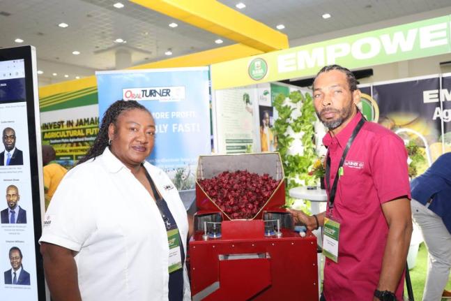 Inventors Allison and Oral Turner with their Sorrel Deeseeder. 