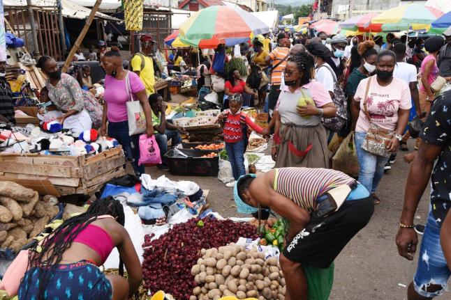
In this 2021 photo people are seen shopping at the Grand Market in Linstead.