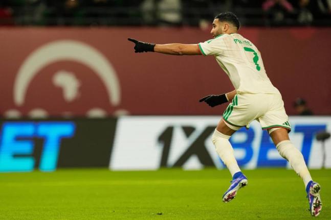 Algeria’s Riyad Karim Mahrez celebrates after scoring his side’s first goal during the Africa Cup of Nations Group E match against Burkina Faso in Fez, Morocco, yesterday.