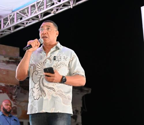Prime Minister Dr Andrew Holness addressing residents of Black River and surrounding communities at the New Year’s fireworks show staged by the Urban Development Corporation on Thursday in the St Elizabeth capital.