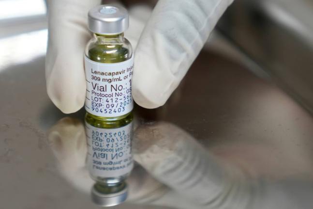 A pharmacist holds a vial of lenacapavir, an injectable HIV prevention drug.