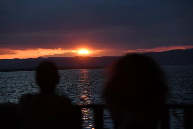 This December 31 photo shows a silhouette of a couple admiring the last sunset of 2025.
