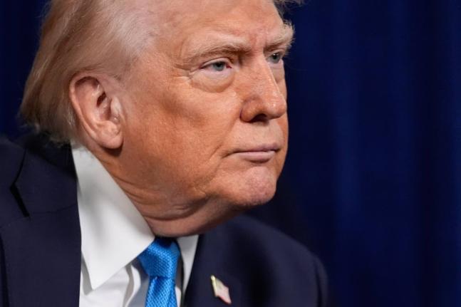 US President Donald Trump listens to a question during a news conference at Mar-a-Lago on January 3, 2026, in Palm Beach, Florida.