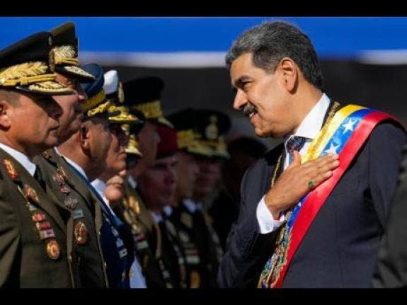 Venezuela's President Nicolas Maduro places his hand over his heart while talking to high-ranking officers during a military ceremony on his inauguration day for a third term, in Caracas, Venezuela on January 10, 2025. The US captured him in Venezuela on J