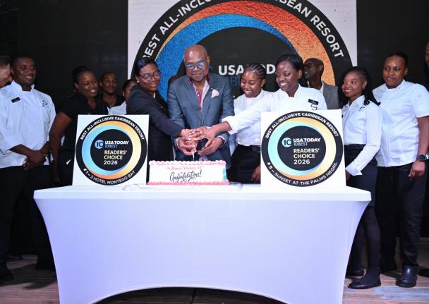 From left: General Manager of S Hotel Montego Bay, Ann-Marie Goffe-Pryce, Minister of Tourism, Edmund Bartlett, S Hotel Montego Bay waitress Ashley Madurie and Chef De Departie Rodrian MacIntosh take part in a cake cutting during the Celebration of the Cit