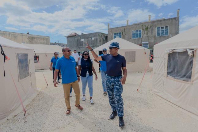Anderson Goodridge (right), emergency medical team commander of the Barbados Defence Force, walks Petrojam’s management team, led by Telroy Morgan (left), general manager, medical volunteers, and Savanna-la-Mar Hospital staff through a tour of the field 