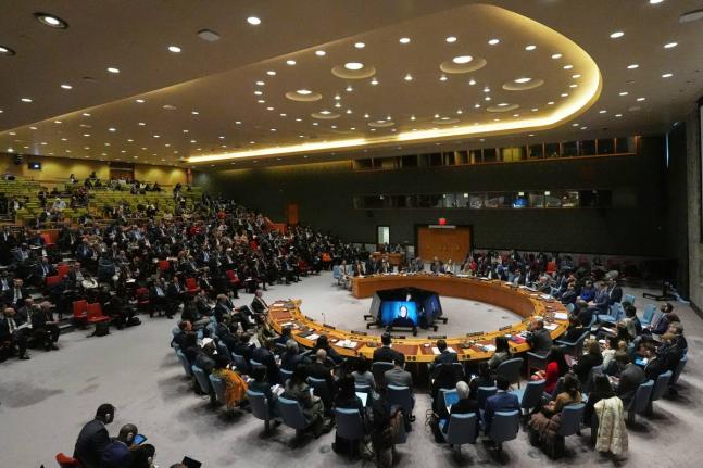 People listen as Venezuela’s UN Ambassador Samuel Moncada speaks during a meeting of the Security Council.