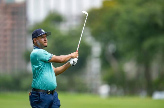 Zandre Roye watches the ball closely after making a shot on the Lima Golf Club during the first round of the 11th Latin America Amateur Golf Championship in Peru on Thursday.