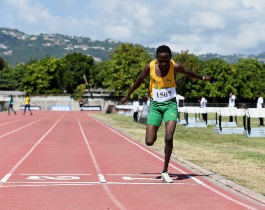 Ryan Achau of St Jago High School comes home a lonely winner in the Class One boys’ 1500 metres at the McKenley/Wint Invitational Meet at Calabar High School last year.