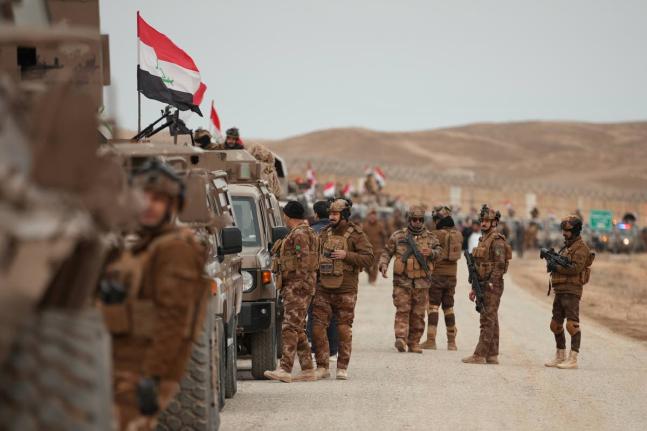 Border Guards patrol along the border with Syria, in Sinjar, northern Iraq.