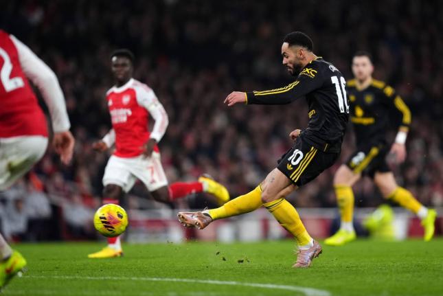 Manchester United’s Matheus Cunha scores his side’s third goal during the English Premier League match between Arsenal and Manchester United in London yesterday.