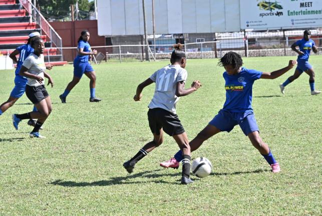 Midfield action from one of the matches in the annual Tarania ‘Plum Plum’ Clarke Girl Power Invitational tournament held last Friday at the Anthony Spaulding Sports Complex in Arnett Gardens, Kingston.