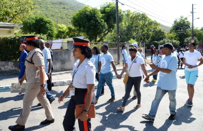 Members of the Jamaica Constabulary Force among persons participating in a Peace march in August on Monday January 16, 2017.