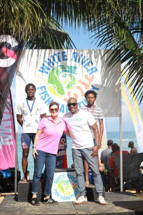 Medallists Brandon Wong (left) and Jaeden Tyler-Grant (right) are joined by Debra Lopez-Spence, president, Scotia Jamaica Life Insurance (second left), and Communications Manager Elon Parkinson of sponsors ScotiaInsurance  and Petrojam Limited, respectivel