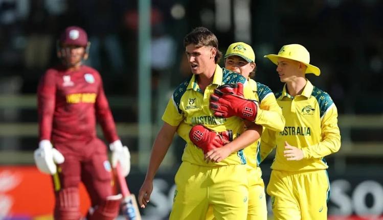 Australia Under-19s (right) celebrate a West Indies wicket during the ICC Men’s Under-19 Cricet World Cup in Harrare, Zimbabwe yesterday.