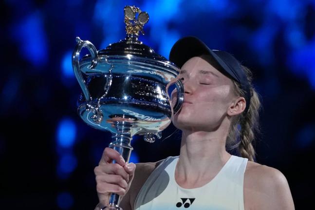 
Elena Rybakina of Kazakhstan kisses the Daphne Akhurst Memorial Cup after defeating Aryna Sabalenka of Belarus to win the women’s singles final at the Australian Open tennis championship in Melbourne, Australia, yesterday.