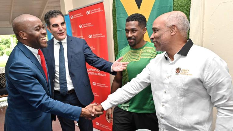 John P Azar (second left), president of Tennis Jamaica, chats with (from left), Peter Mohan, Scotiabank AICB manager, sponsor; Daminic Pagon, captain of the Jamaica Team; and Christopher Samuda, president of Jamaica Olympic Association, at the Davis Cup la