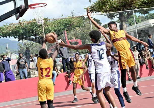 ISSA Under-16 Basketball final action between Wolmer’s Boys’ School and Jamaica College at Campion College yesterday.