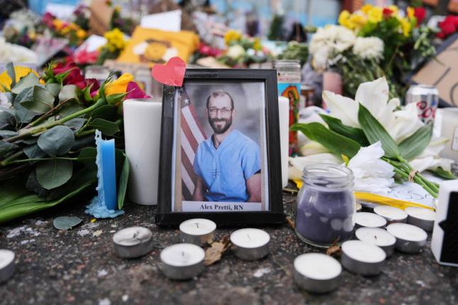 
A photo of 37-year-old Alex Pretti, who was fatally shot by a US Border Patrol officer, is displayed at the shooting scene in Minneapolis.