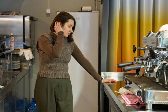 Co-founder of a café, Yana Bilym, 33, reacts in her inactive café because of Russia’s air attacks on the country’s energy system.