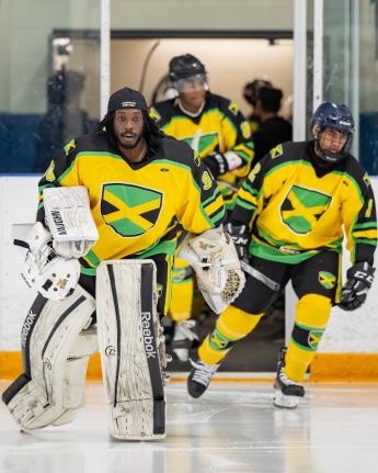 Giovani Smith leads Jamaica’s ice hockey team out on to the rink during a Challenger Series game played across Chicago, New York, and Toronto last year.