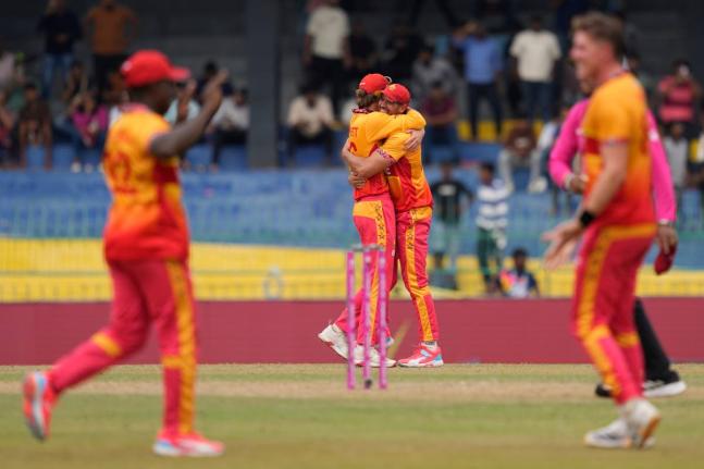 Zimbabwe’s players celebrates after winning the T20 World Cup cricket match against Australia in Colombo, Sri Lanka on Friday.