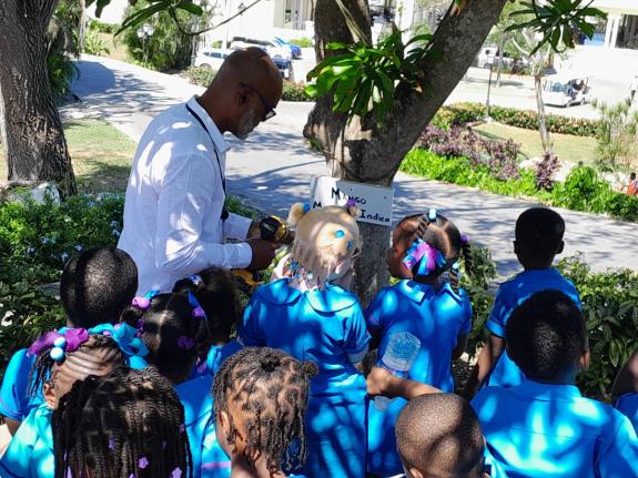 Students labelling trees at Grand Palladium Resort.