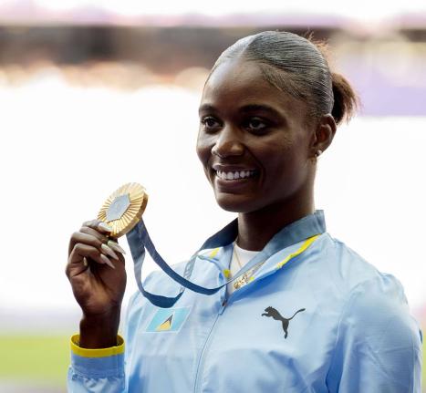Julien Alfred of St Lucia displays the gold medal she won at the 2024 Paris Olympic Games.