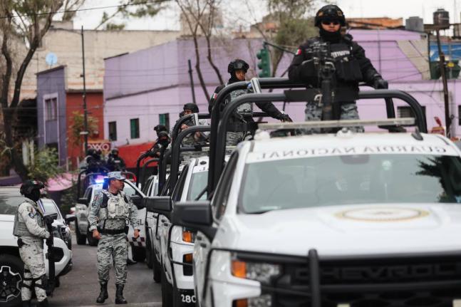 National Guards patrol the area outside of the General Prosecutor's headquarters in Mexico City, Sunday, February 22, 2026, after authorities reported that the Mexican Army killed Jalisco New Generation Cartel leader Nemesio Oseguera, known as "El Mencho."